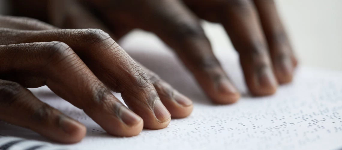 Person reading Braille