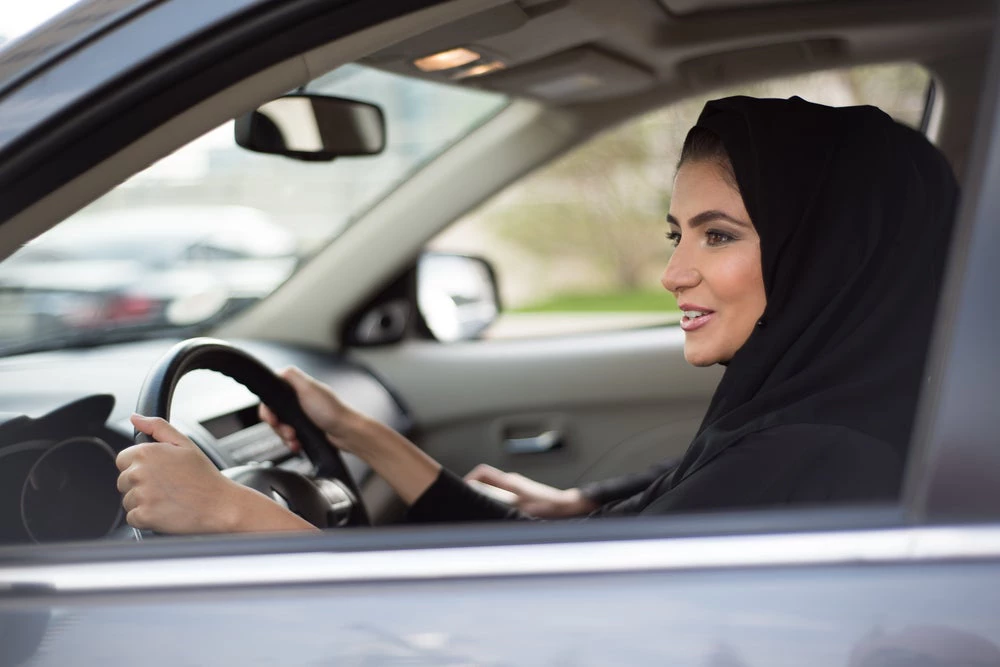 Woman driving car in the Arabworld. (Shutterstock.com/Feroze Edassery)