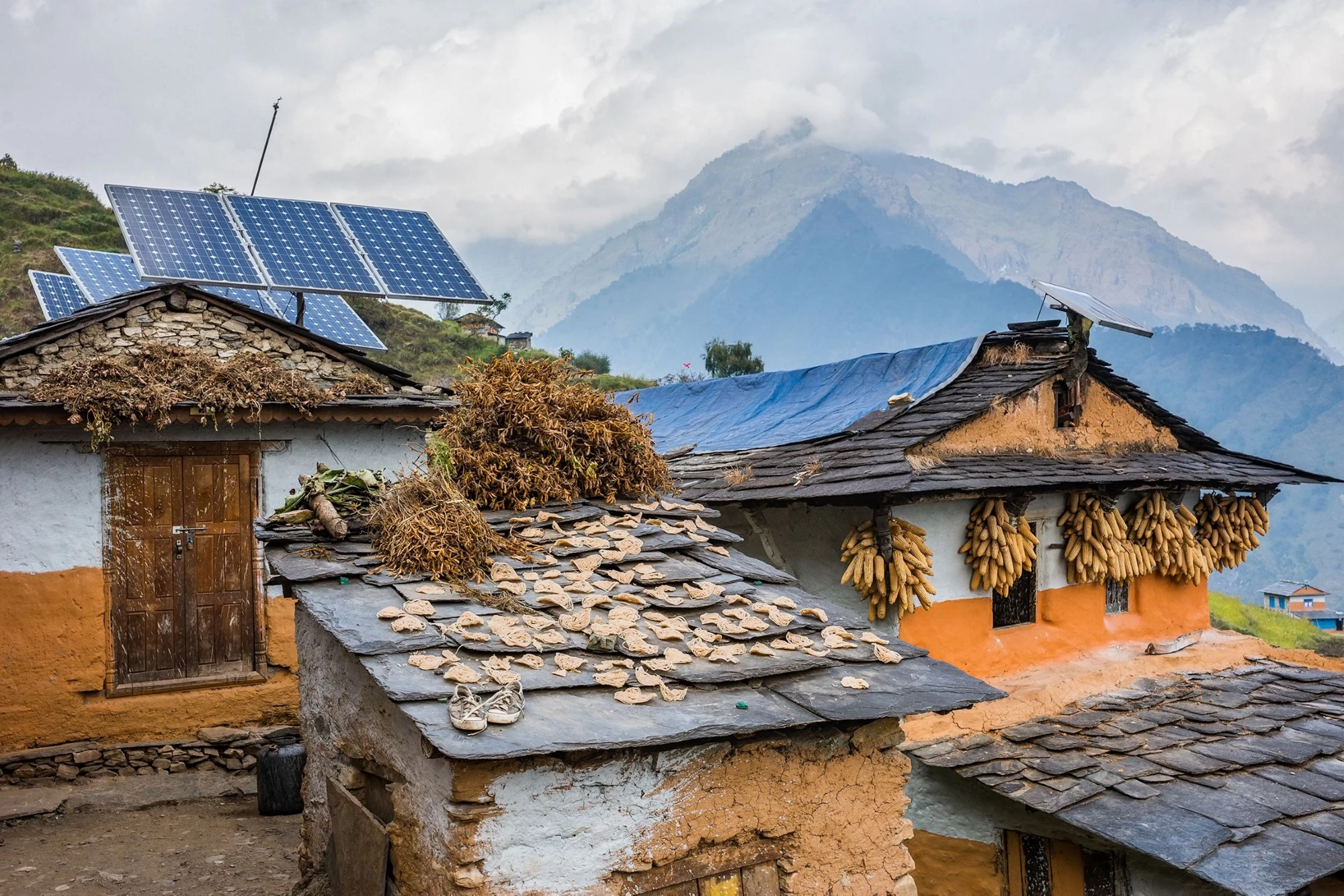 Nepali traditional houses with solar cell panel on the roof. Muri village, Dhaulagiri region, Nepal.
