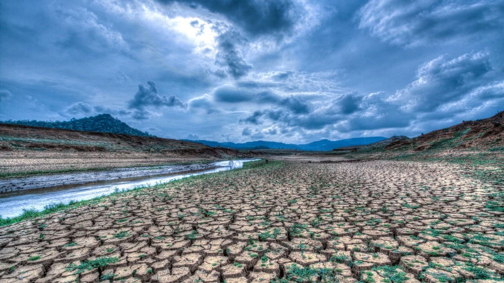 Climate change and drought land, Global warming concept, drought cracked river banks landscape, dry reservoir