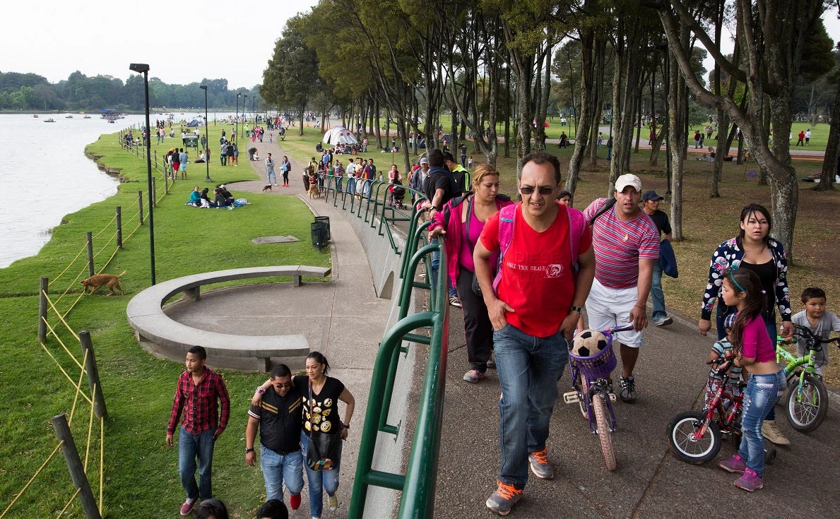 Families walking in Simon Bolivar Park in Bogotá, Colombia