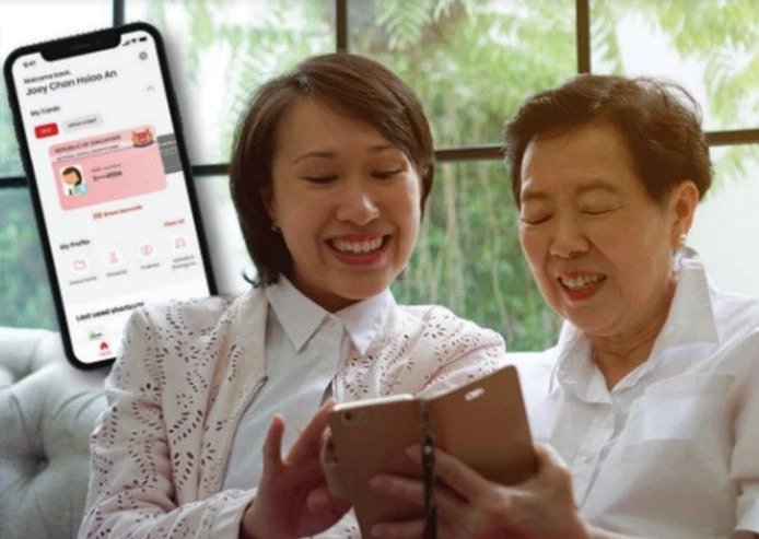 A woman and her mom use their Singapore National Digital Identity to access services online
