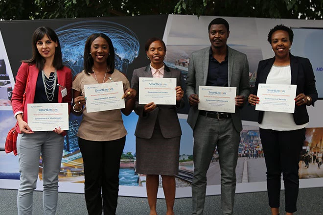 Finalists in the SmartLessons Competition for Trade Facilitation accept their awards in Geneva at the Aid for Trade Global Review.