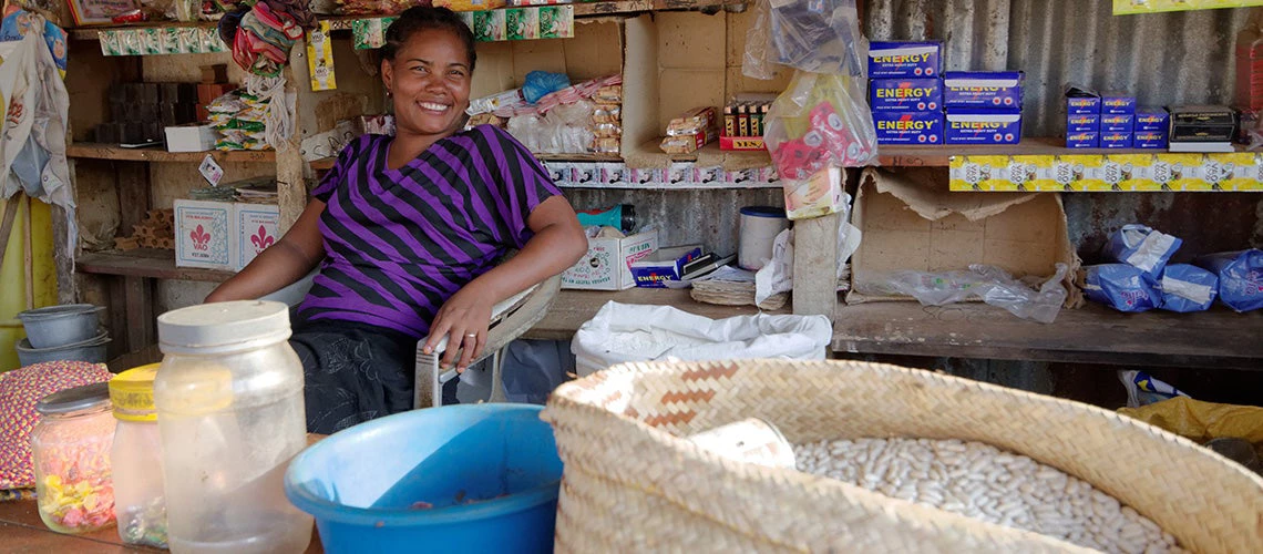 A women smiling while sitting in her shop. | ©shutterstock.com