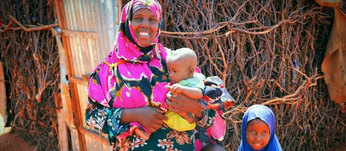 Baxnaano direct beneficiary woman with her three children