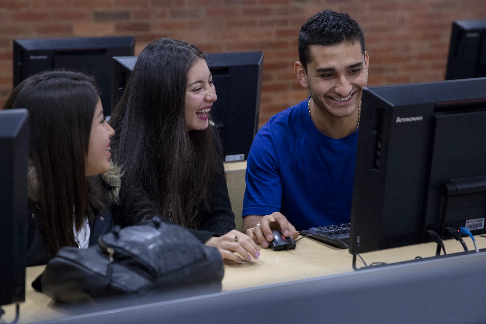 Students enjoying class exercises while learning about graphic design, at Uniminuto, a private university that serves low income students in Bogota, Colombia on March 30, 2017. Photo © Dominic Chavez/International Finance Corporation