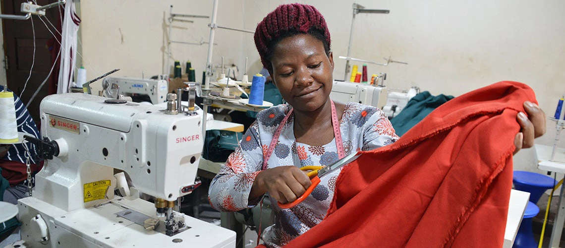 A lady tailor in Kisugu suburb in Kampala district. Photo: Rachel Mabala.