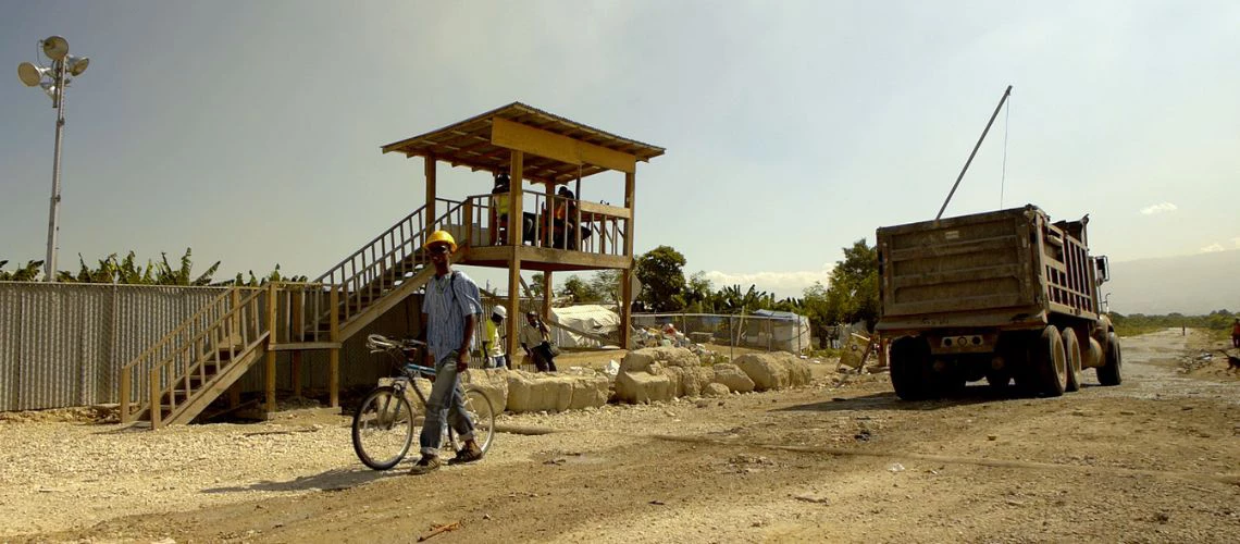 Trucks carrying the rubble from Port au Prince, Haiti into Truitier debris management site pass a checkpoint which controls for content and weight. 