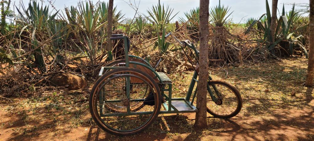 A customized wheelchair with bicycle-like wheels designed for easier navigation on rough terrain in Rural Tanzania. An example of how families with persons with disabilities are innovating around inaccessible infrastructure. Photo: World Bank