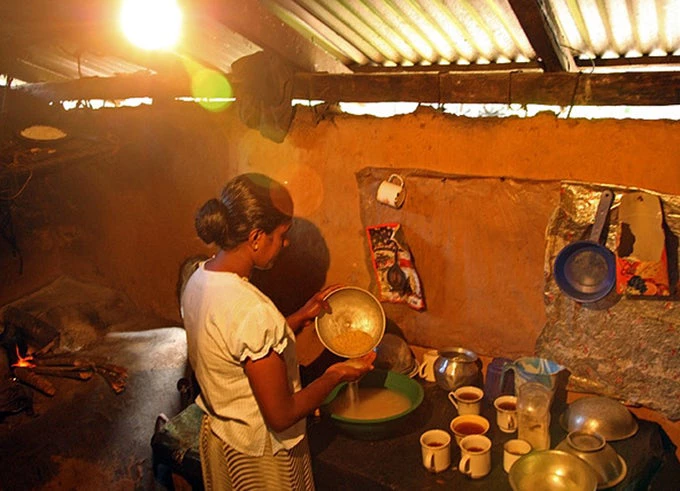 Sri Lankan woman washing lentils ahead of preparing a meal