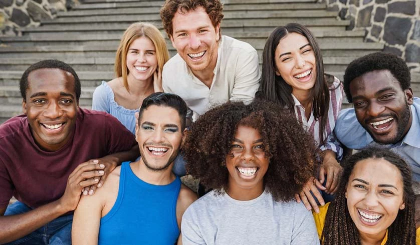 A group of young, diverse people laughing together