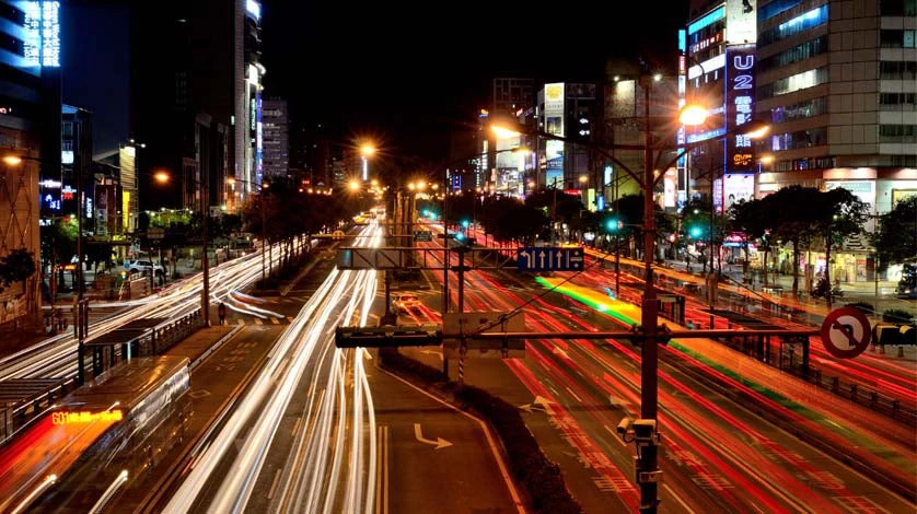 Image of a bustling city street at night