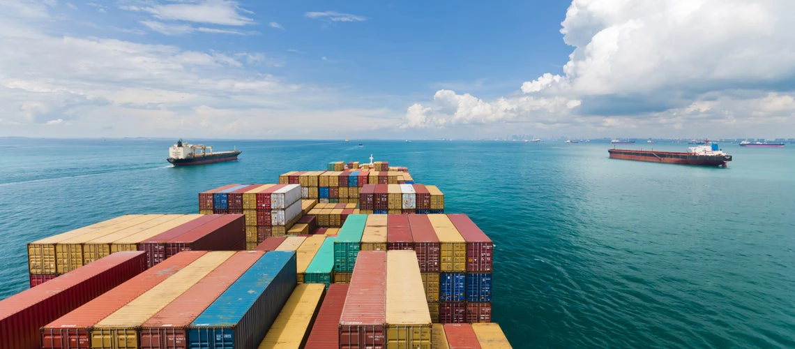 Cargo ships entering one of the busiest ports in the world, Singapore. Photo credit: Shutterstock.com