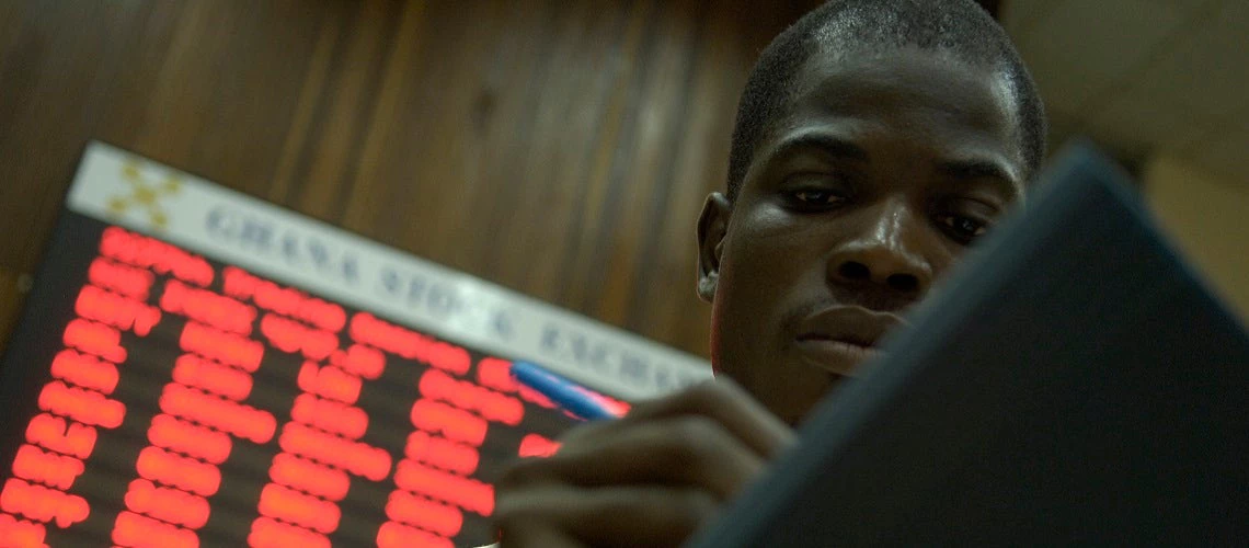 Traders work on the floor of the Ghana Stock Exchange