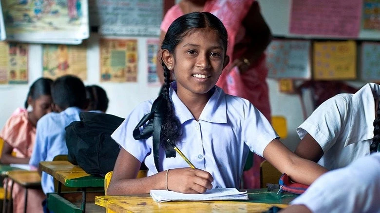 A female student sitting in a classroom.