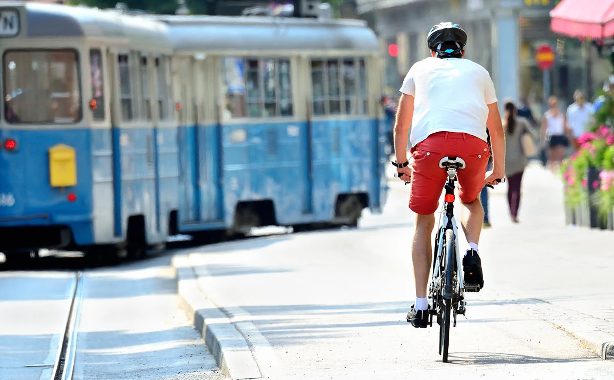 Bike commuter and tram. Photo: Connel/Shutterstock