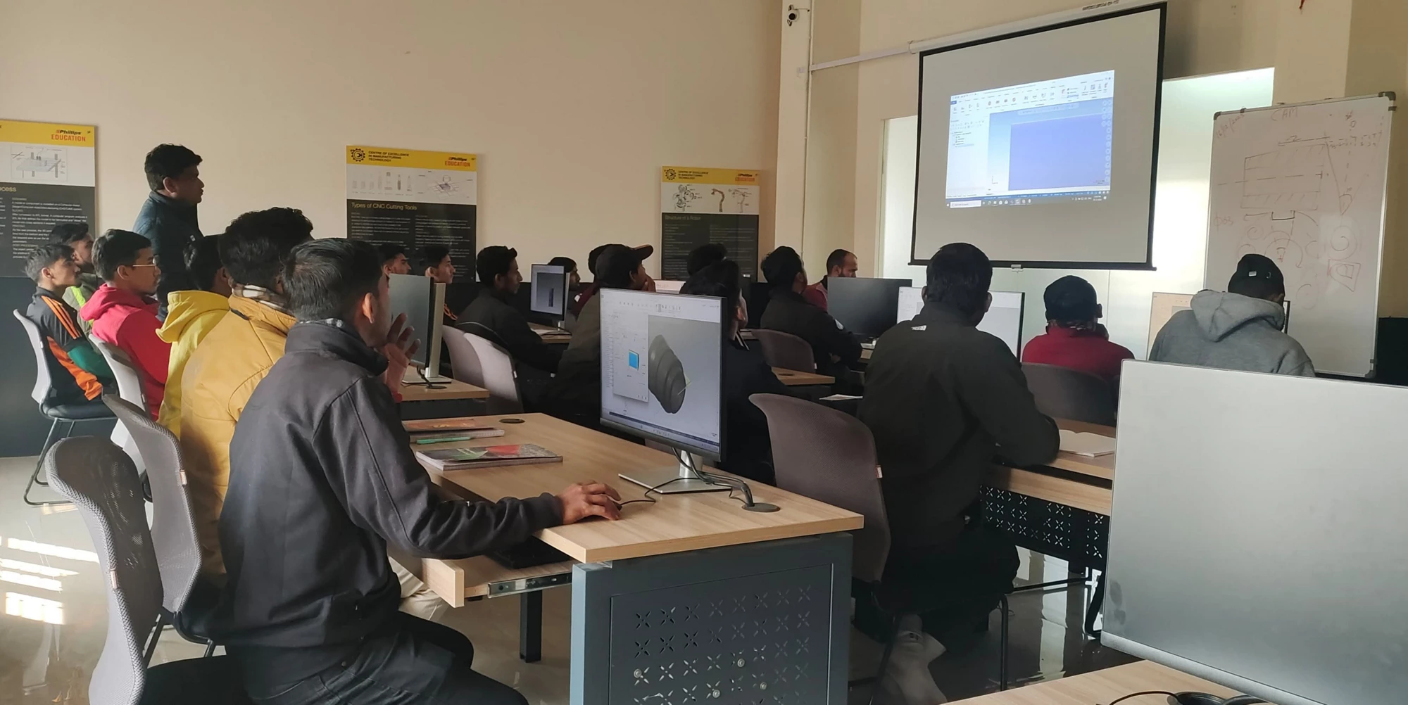 Students sitting at desks in a classroom at the Center of Excellence under public-private partnership at the ITI in Haridwar. 