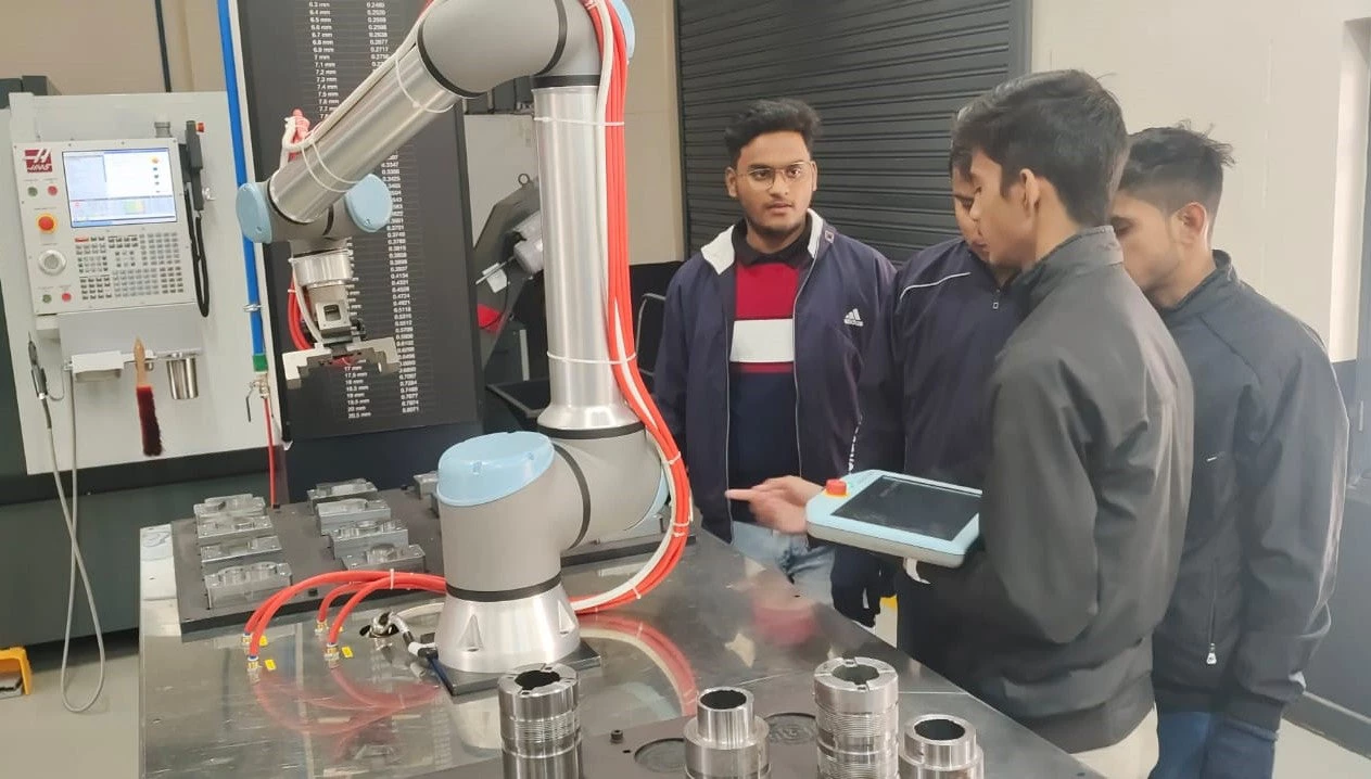 Students working on a machine in a laboratory at the Center of Excellence, ITI in Haridwar. 