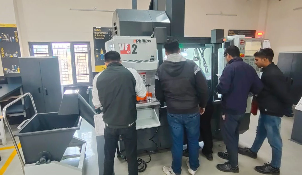 Students working on a machine in a laboratory at the Center of Excellence, ITI, in Haridwar. 