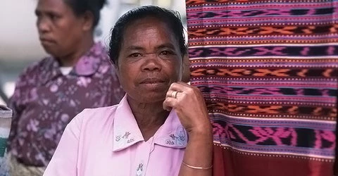 A vendor stands next to her wares in East Timor. Alex Baluyut/World Bank