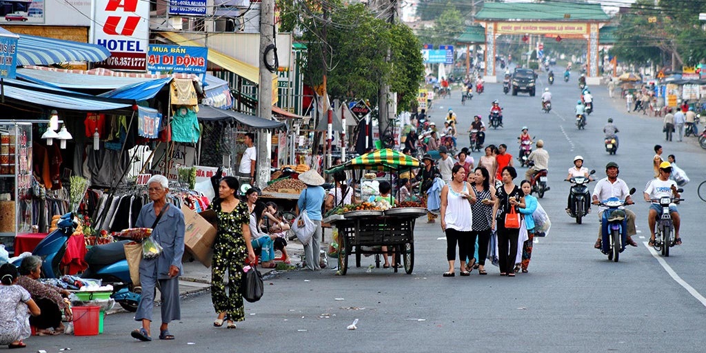 A bustling street scene in Chau Doc, Vietnam