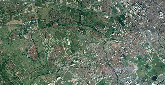 This aerial view of Hanoi, Vietnam, clearly shows areas of decreasing density between the city and the countryside, making it hard to define the limits of the "urban" area.
