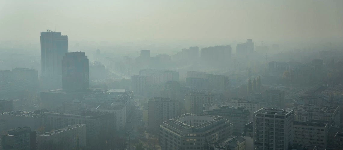 Aerial view of the city of Warsaw, Poland, covered in smog