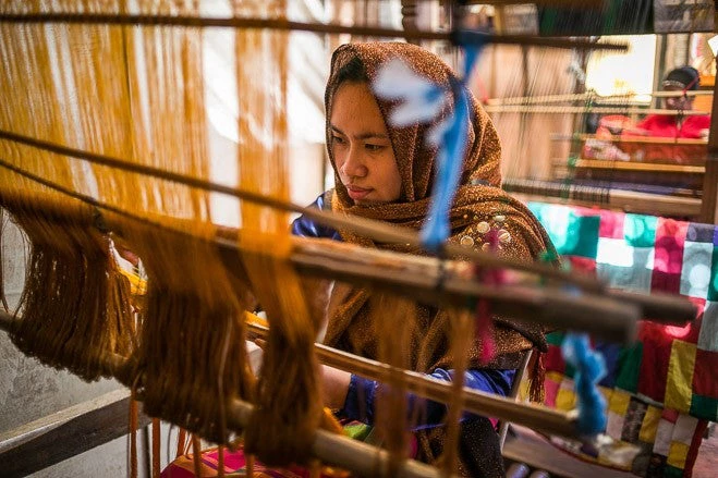 A woman weaving in Maguindanao province,