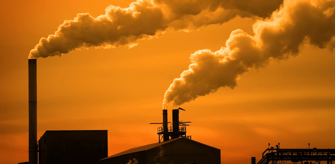 Pollution and smoke from factory and power plant chimneys. Shutterstock/L.V. Erickson