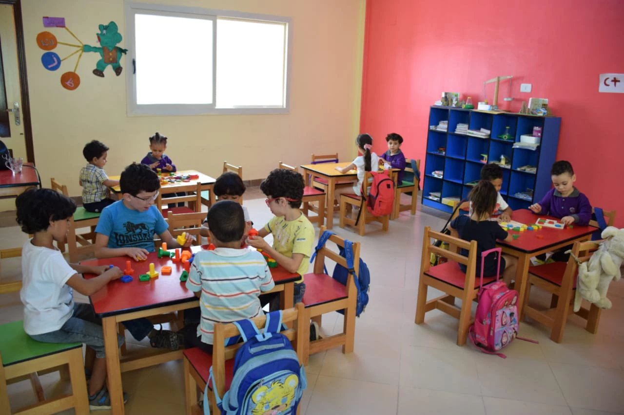 Children play with their learning tools at a childcare center in Egypt.