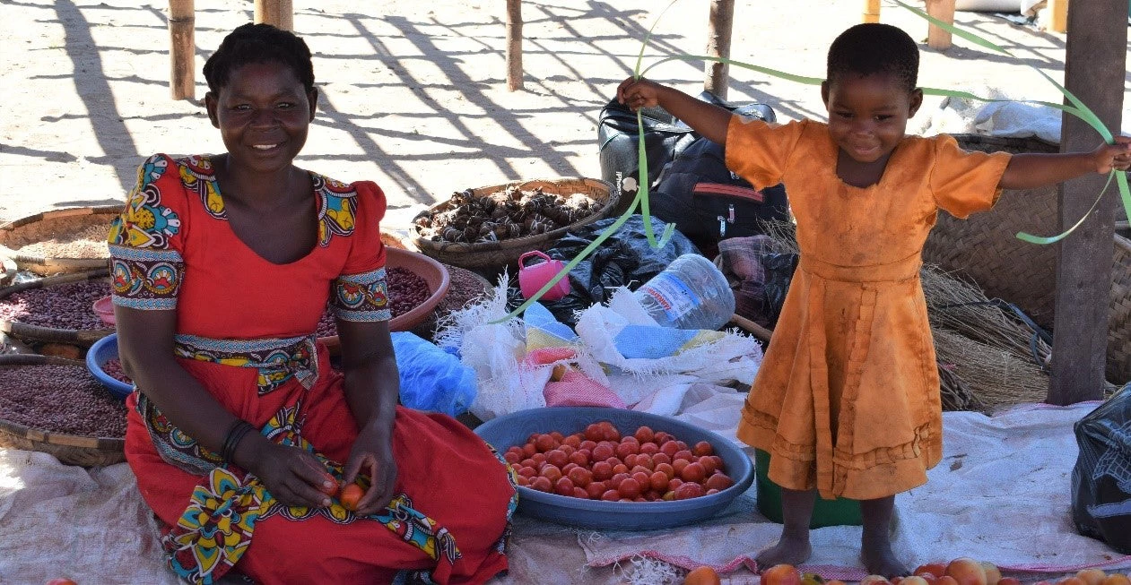 Photo: woman and child at a market