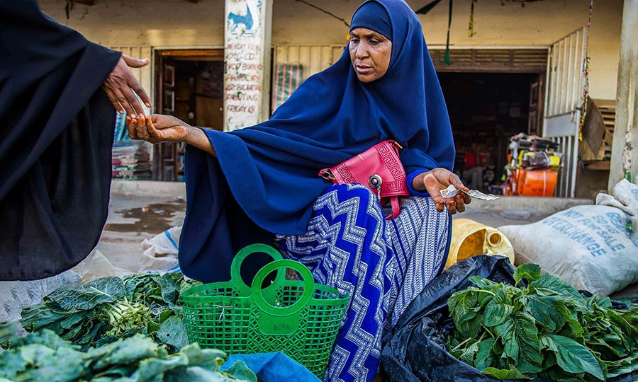 Woman selling vegetables