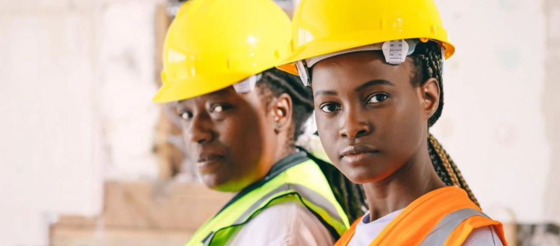 Women with construction hats 