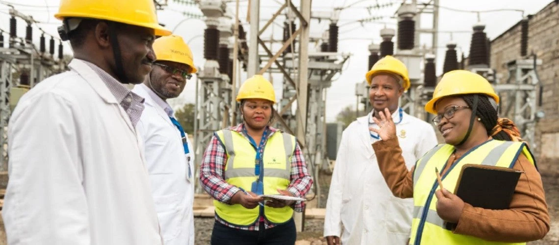 Grace Aswani Ngigi Manager, Insurance Services & Integrity Department Kenya Power and Lighting Company, with colleagues at substation.