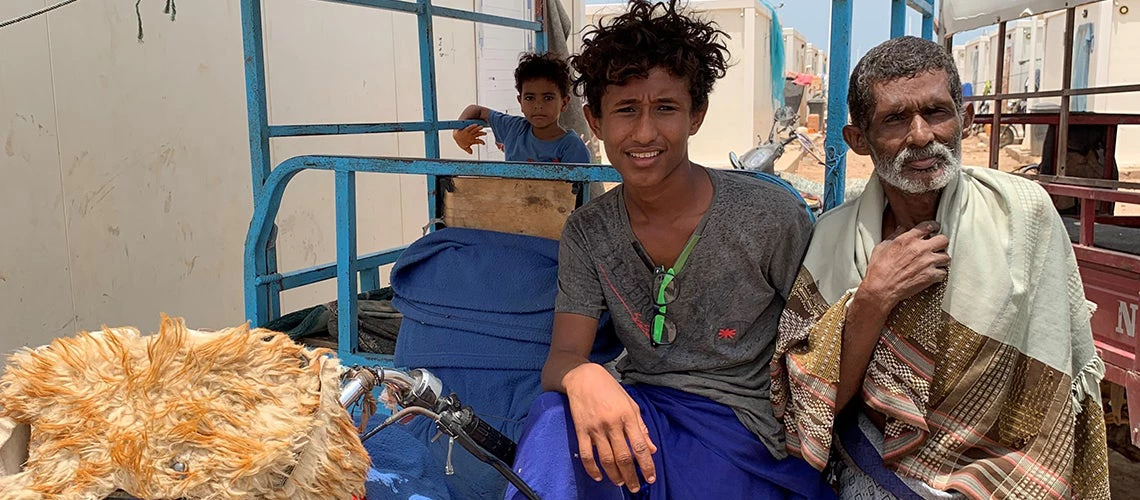 This father and son invested in purchasing a series of tuktuk and motocycles to transport people, food and supplies in the Markazi refugee camp for Yemeni refugees in Obadiah, Djibouti. Photo: Benjamin Herzberg/World Bank